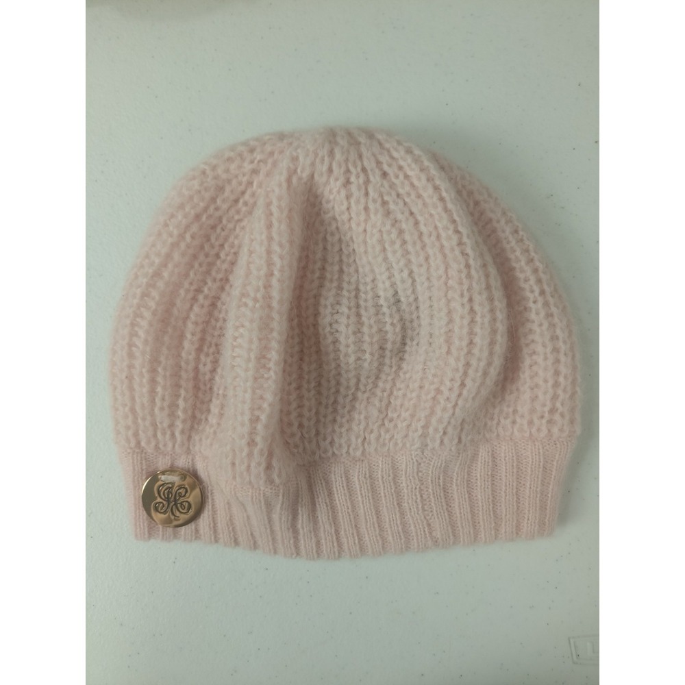 Juicy Couture women's‎ knitted beanie featuring a ribbed texture in pastel pink,